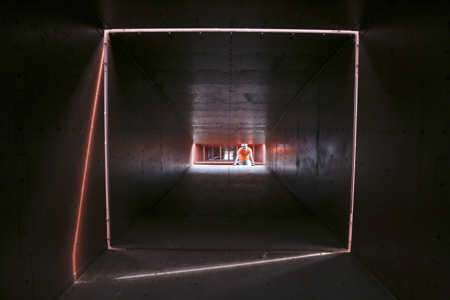 Engineering graduate student looks inside the shock tube